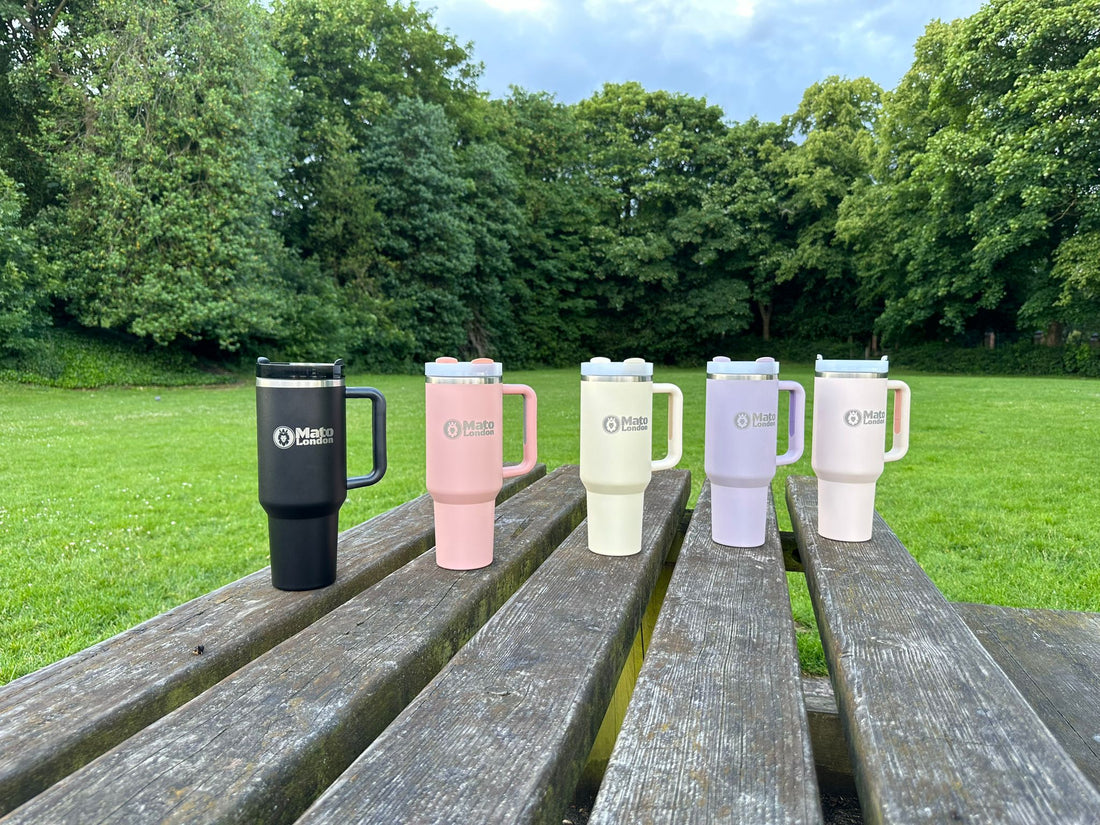 Mato London 40oz tumblers in multiple colours displayed outdoors – eco-friendly stainless steel travel mugs, perfect Christmas gift for coffee and tea lovers
