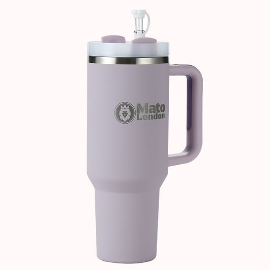 Purple 40oz insulated stainless steel tumbler with a moulded side handle and reusable straw, shown on a light background